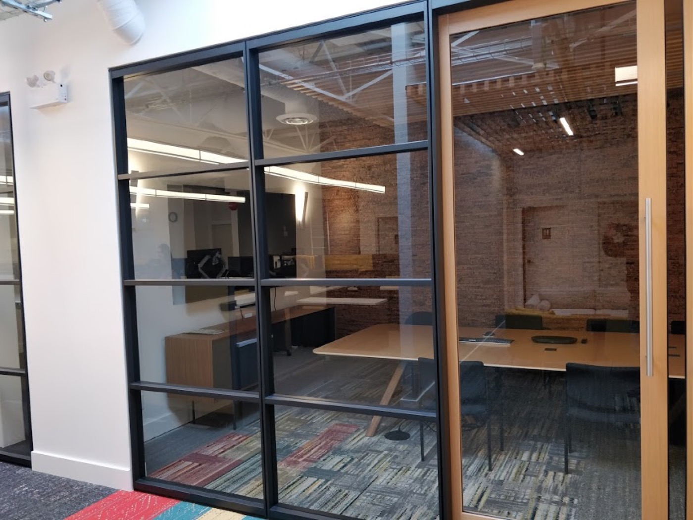 Completed meeting-room area in the Burquitlam strata tenant improvement near Lougheed Mall