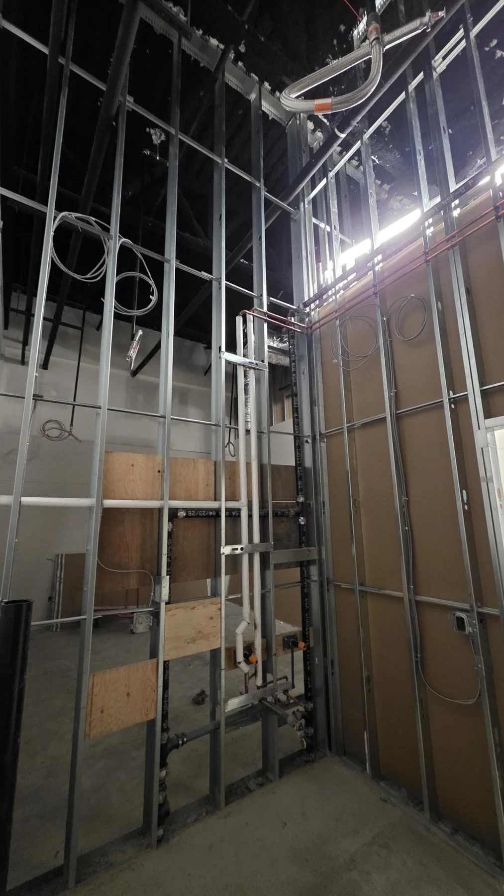 Open-wall steel stud framing and backing at Club Champion in Surrey